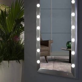 Silver framed mirror with lights in living room