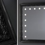 black framed mirror with lights